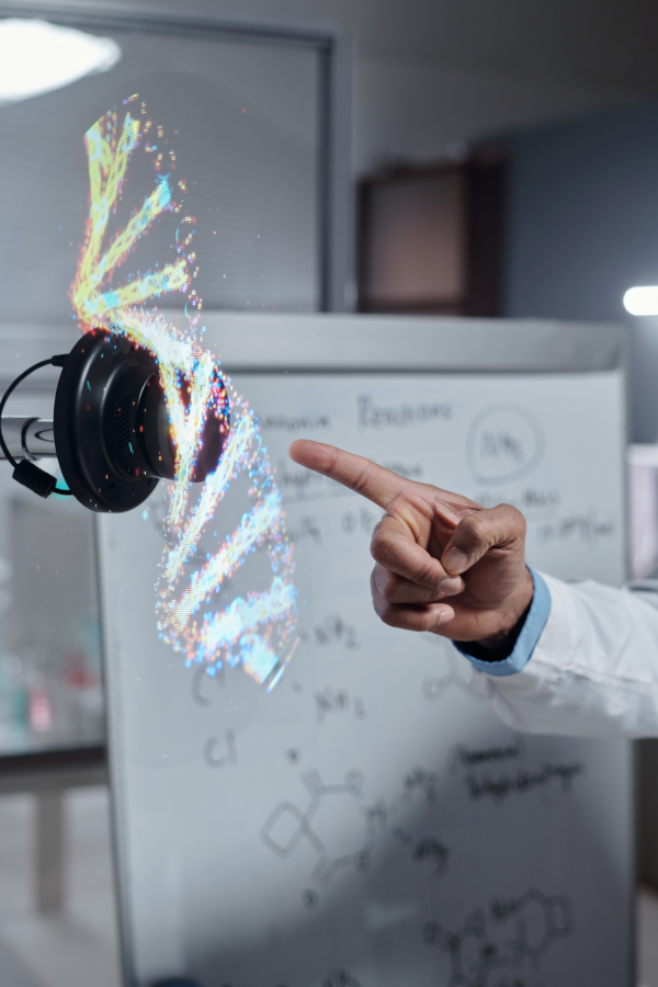 Hands of business people pointing and discussing charts and graphs on printed reports at a desk.