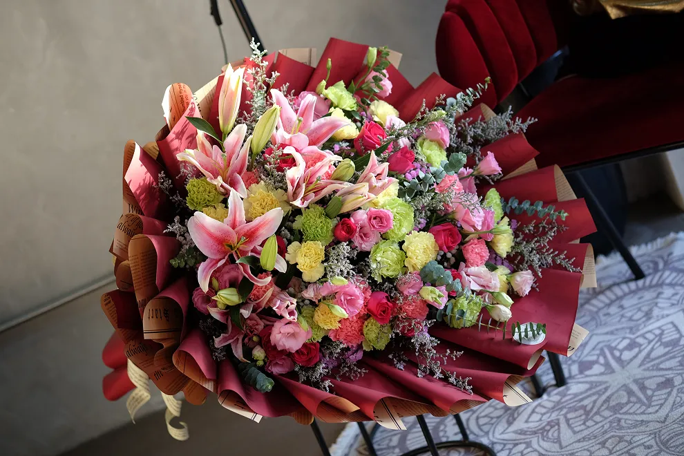 A bouquet of colorful flowers sitting on top of a table.
