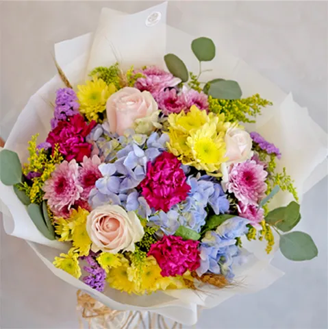 A bouquet of colorful flowers sitting on top of a table.