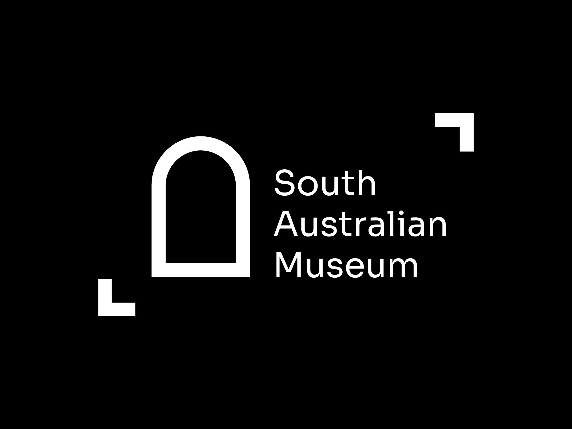 The South Australian Museum rebrand modernises the institution’s visual identity while preserving its history, curiosity, and cultural significance. At its core is a simplified arch motif, inspired by the Museum’s original architecture, a symbol of discovery and connection between the natural and human worlds. The logo invites visitors to look closer, step through, and uncover what lies beyond. A modular pattern system, derived from the logo’s geometry, creates a cohesive visual language across print and digital applications. This reflects pathways of exploration and interconnectedness, adding depth and flexibility to all communications. The refined colour palette pairs deep natural tones with clean neutrals, echoing the Museum’s environment and diverse collections. Modern typography and a structured layout system ensure clarity, accessibility, and consistency across signage, brochures, and digital platforms. The wayfinding system builds on the brand’s geometry to guide visitors seamlessly through the Museum. Using the arch motif, clear type, and colour coding, the signage reinforces the new identity while enhancing navigation. The rebrand positions the South Australian Museum as a contemporary cultural landmark, one that celebrates curiosity, learning, and connection through timeless, modern design.