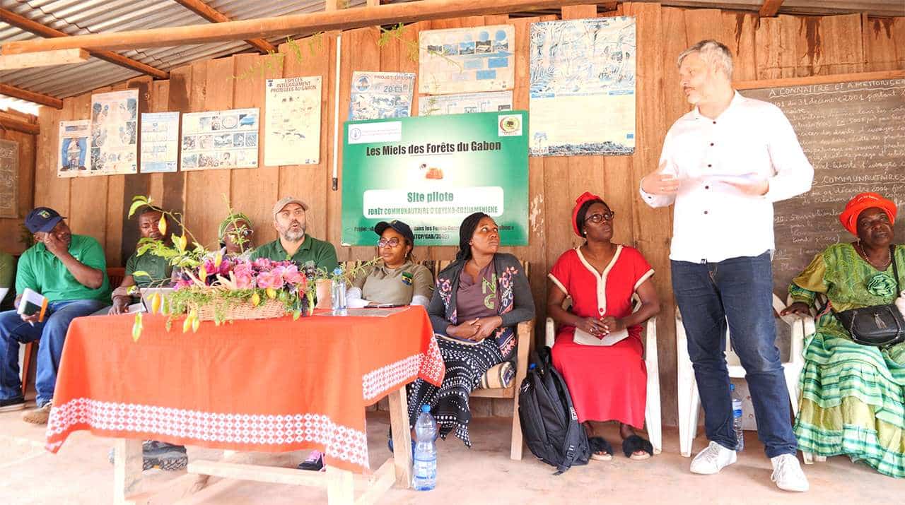 Abyeng-people-sitting-in-line-Most Mature Iboga Farm in the World