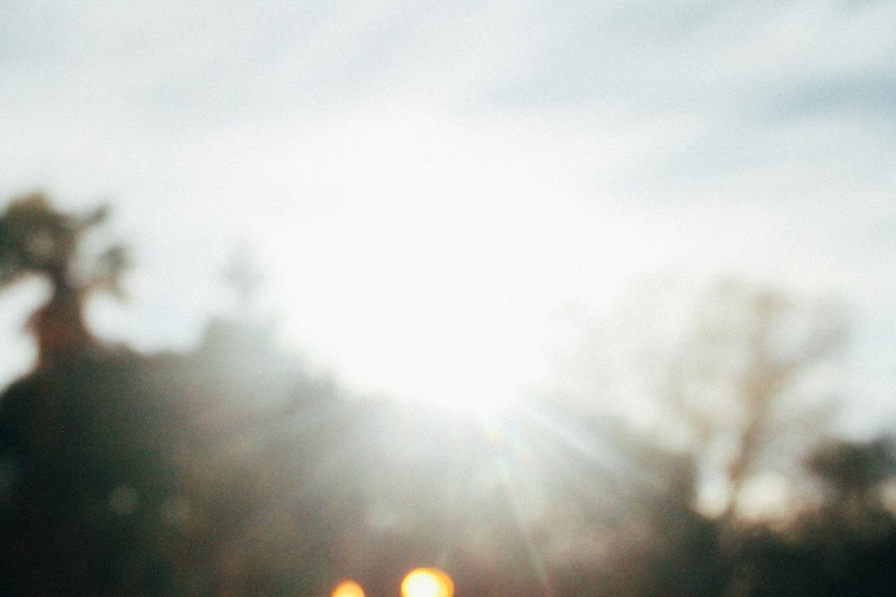 Blurred image of sun and landscape