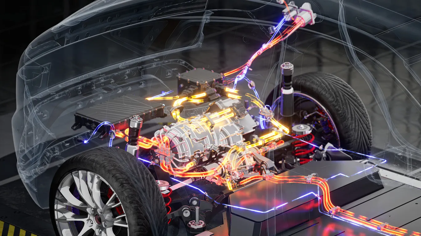 3D illustration of an electric vehicle’s power system showing illuminated wiring and battery connections within a transparent car body.