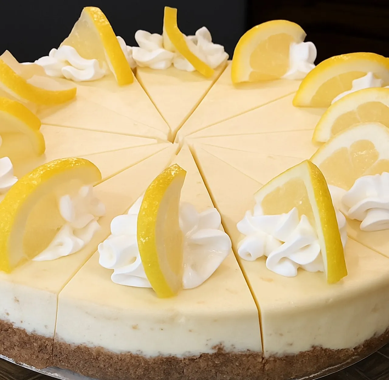 Handmade gourmet cheesecake with rich cream cheese and graham cracker crust from Crumbs