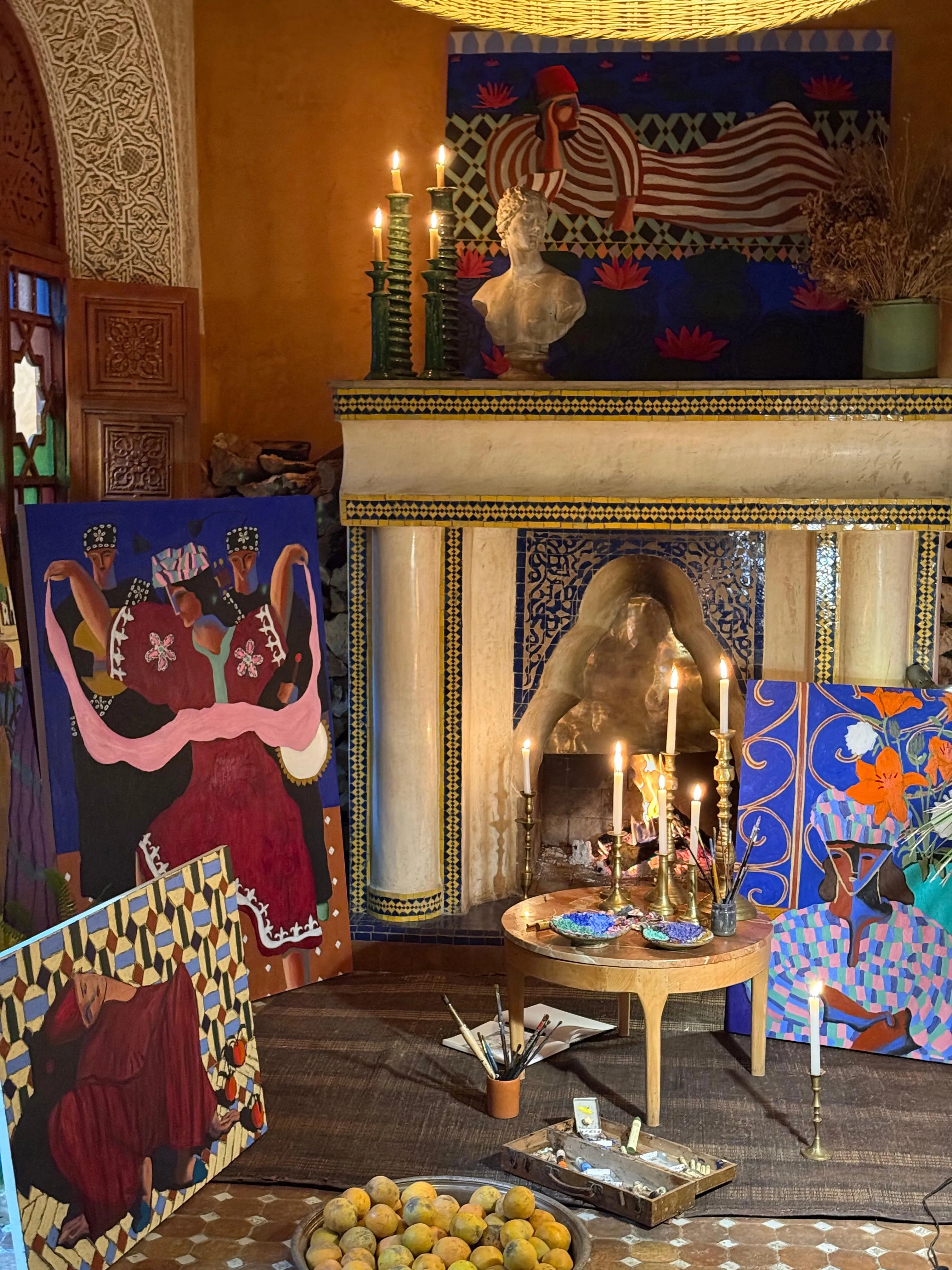 Arsène Welkin's paintings around a candlelit fireplace for the exhibition De Pain et d'Or