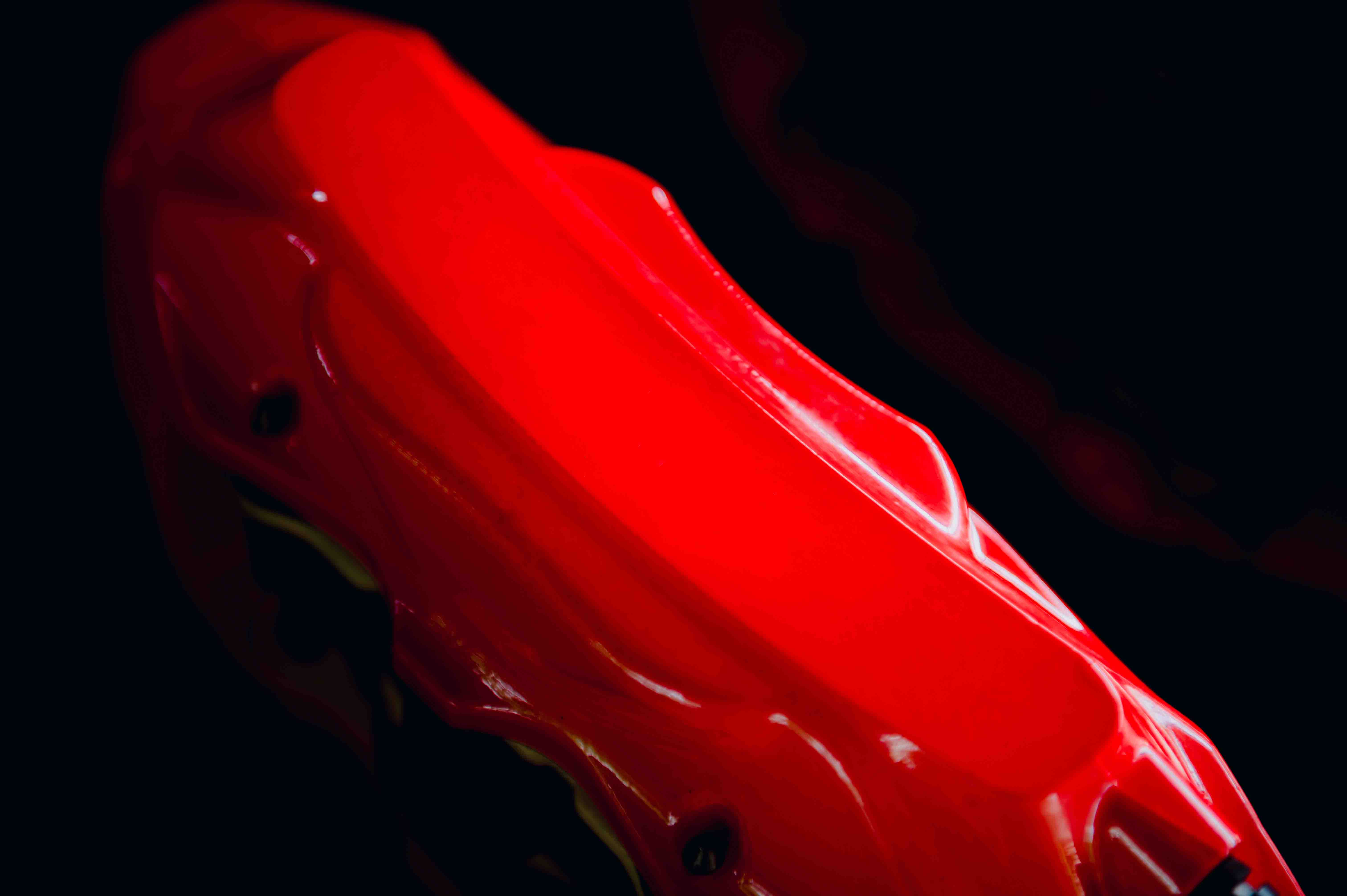 Brake caliper close up painted red.