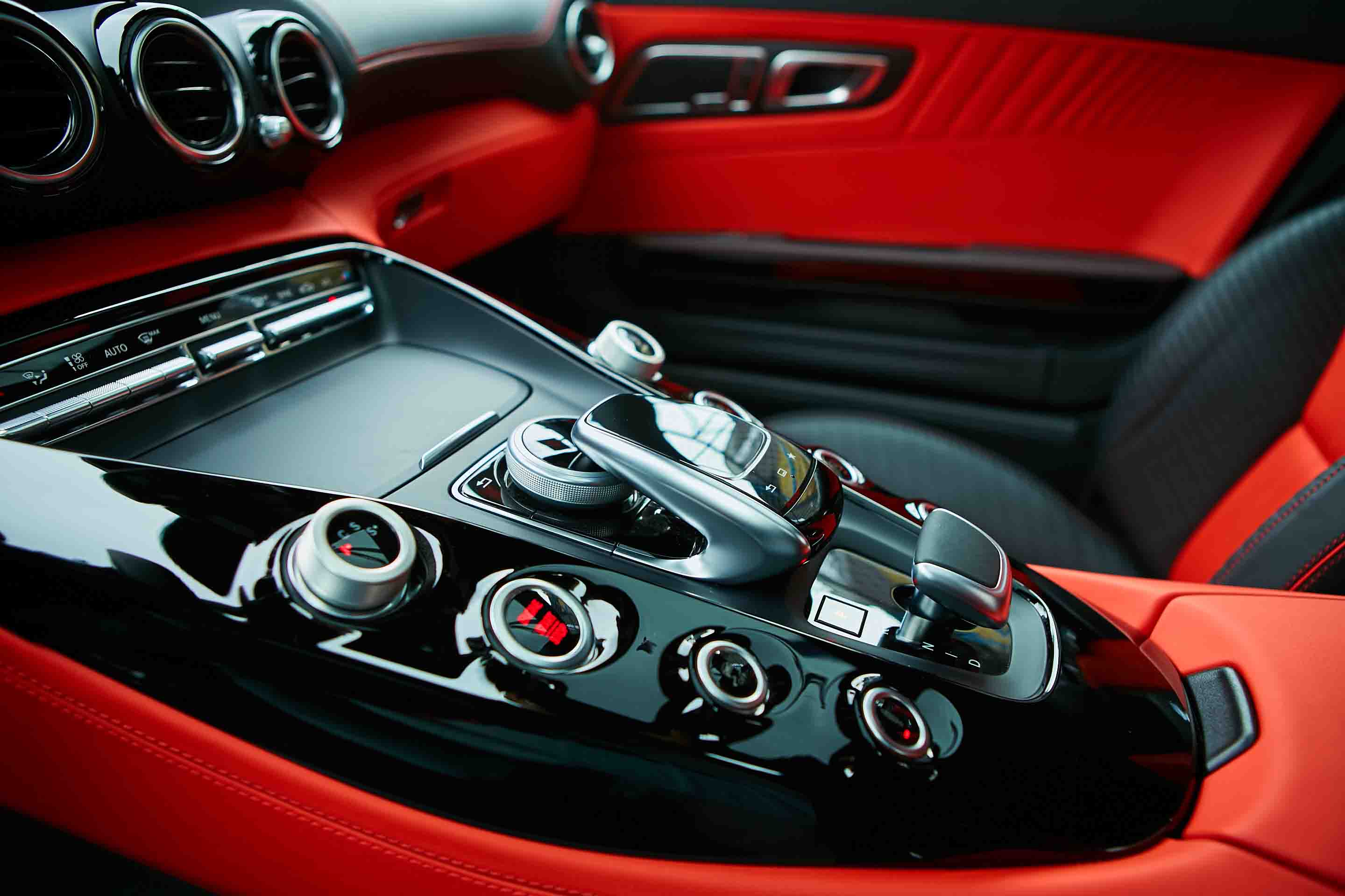 Interior car detail. Red and gloss black.