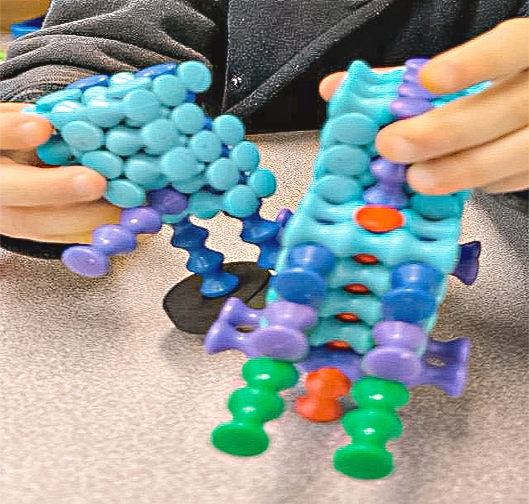 A young child interacting with a toy