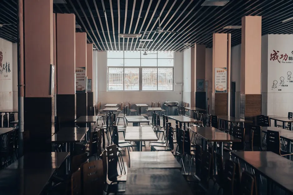 A bright, modern campus cafeteria dining hall with natural lighting and sustainable design