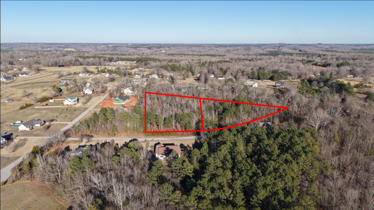 image of a dusty road surrounded by grass