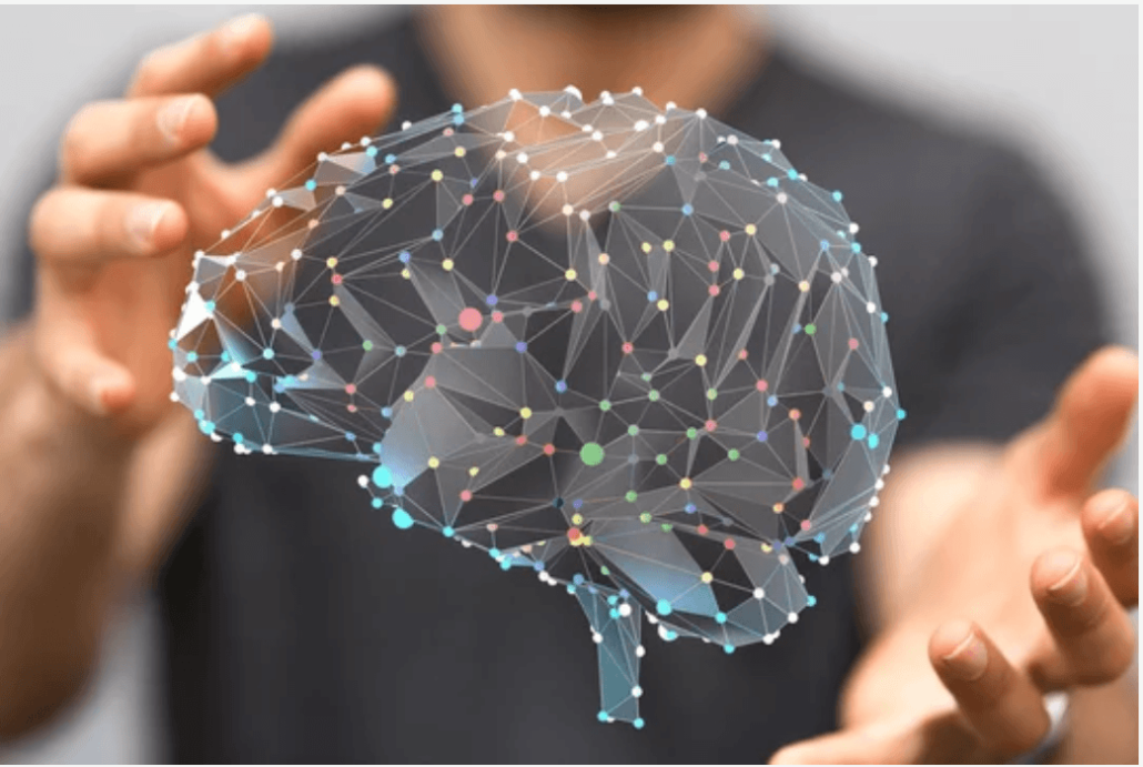 Facilitator presenting at a flip chart during a team meeting.