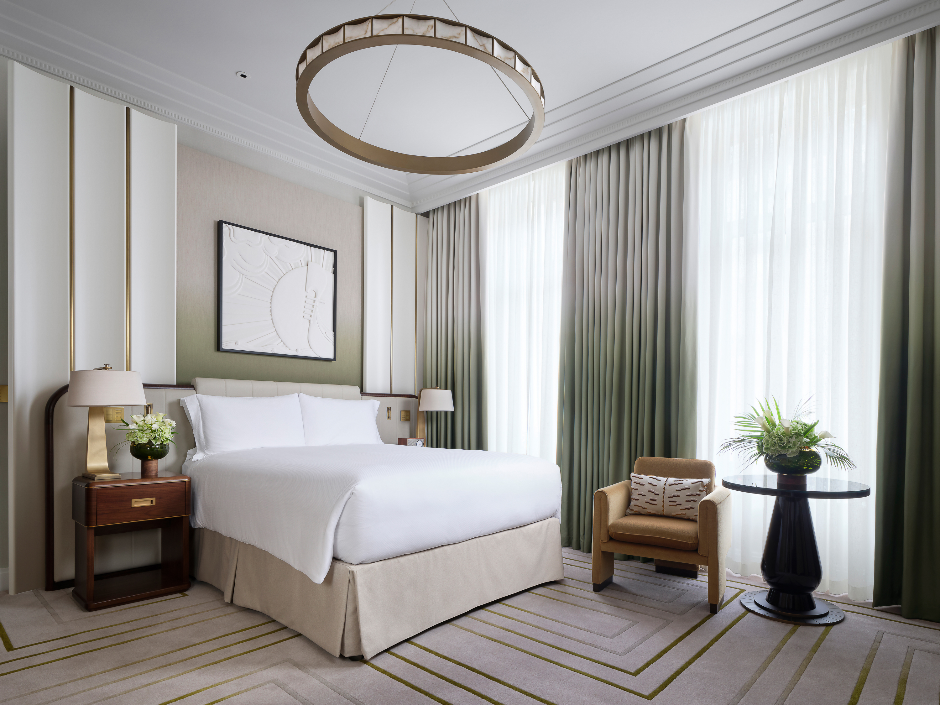 Set in either Edwardian or Art Deco design, the Deluxe King Room offers a king bed, tall windows that lift the natural light and a marble bathroom, with either a walk-in shower or bathtub. Several face the courtyard or city, and some can accommodate an additional guest with a roll-out bed.
