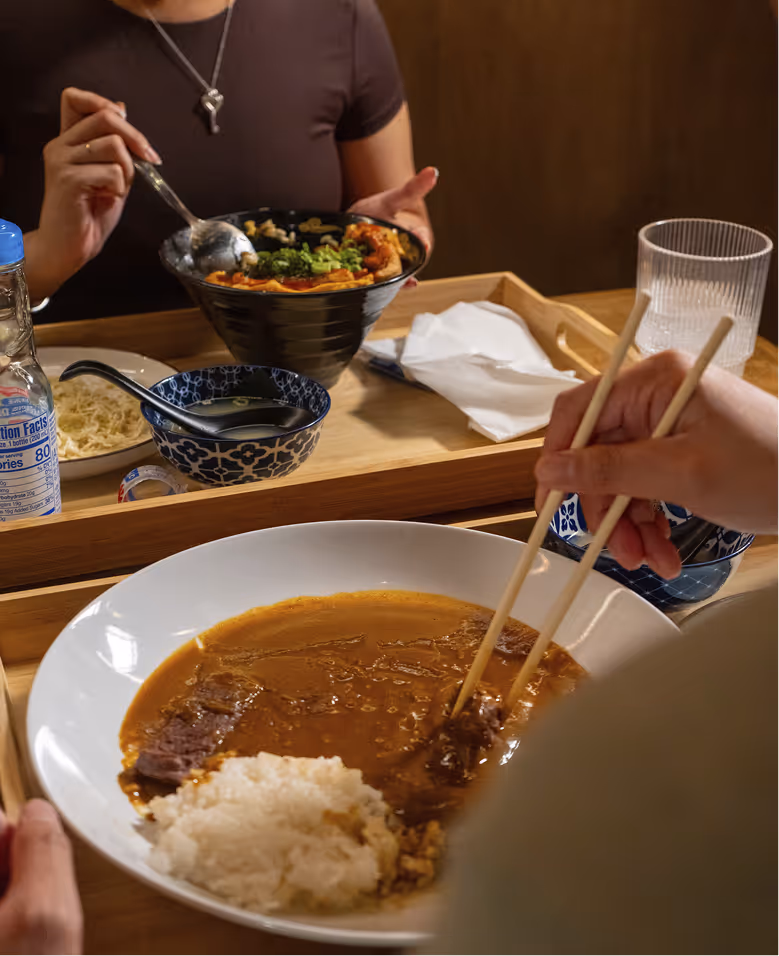 Customers at Curry Ya enjoying their food