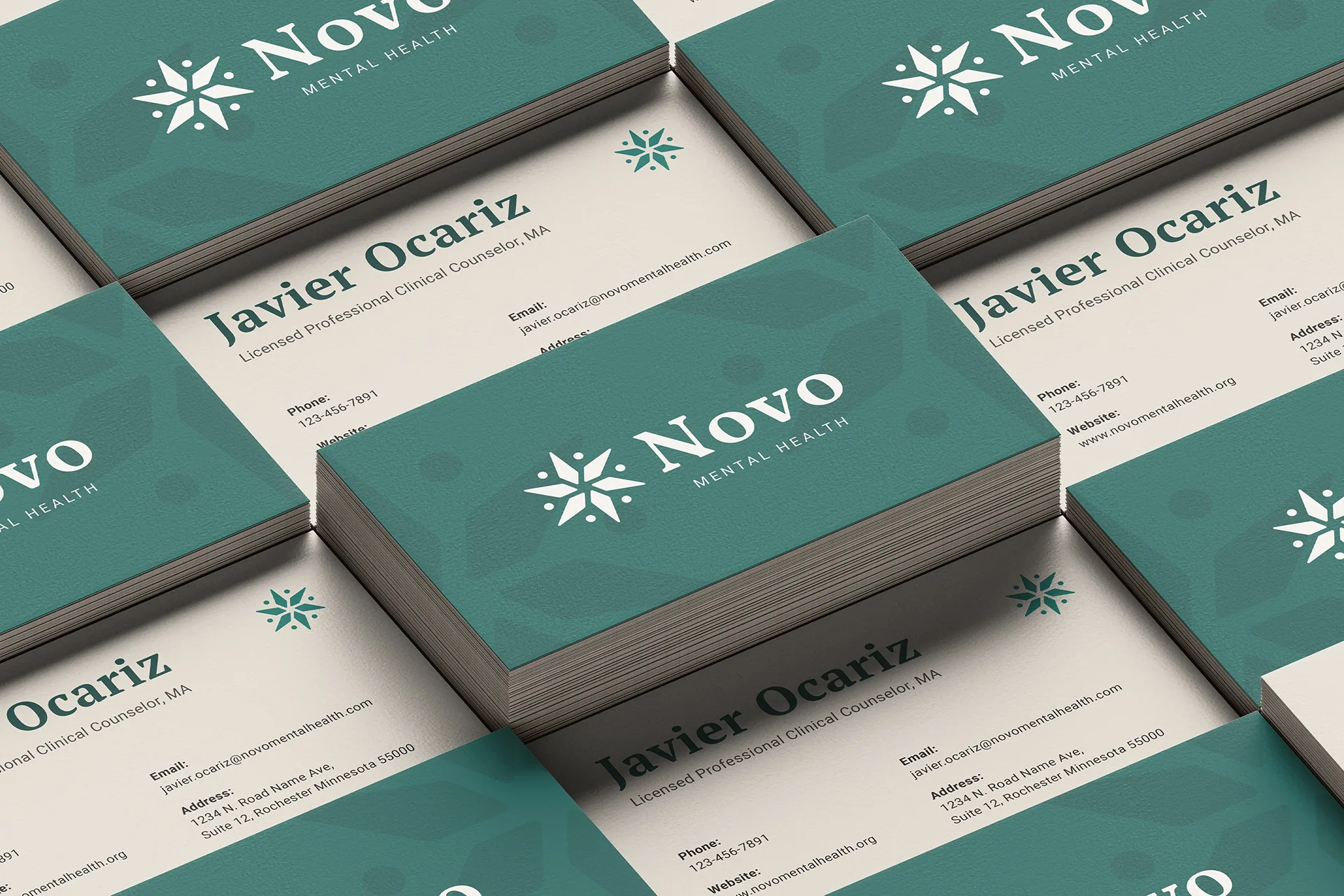 Stacks of Novo Mental Health business cards featuring Javier Ocariz, Licensed Professional Clinical Counselor, with contact details and logo on a teal and white background.