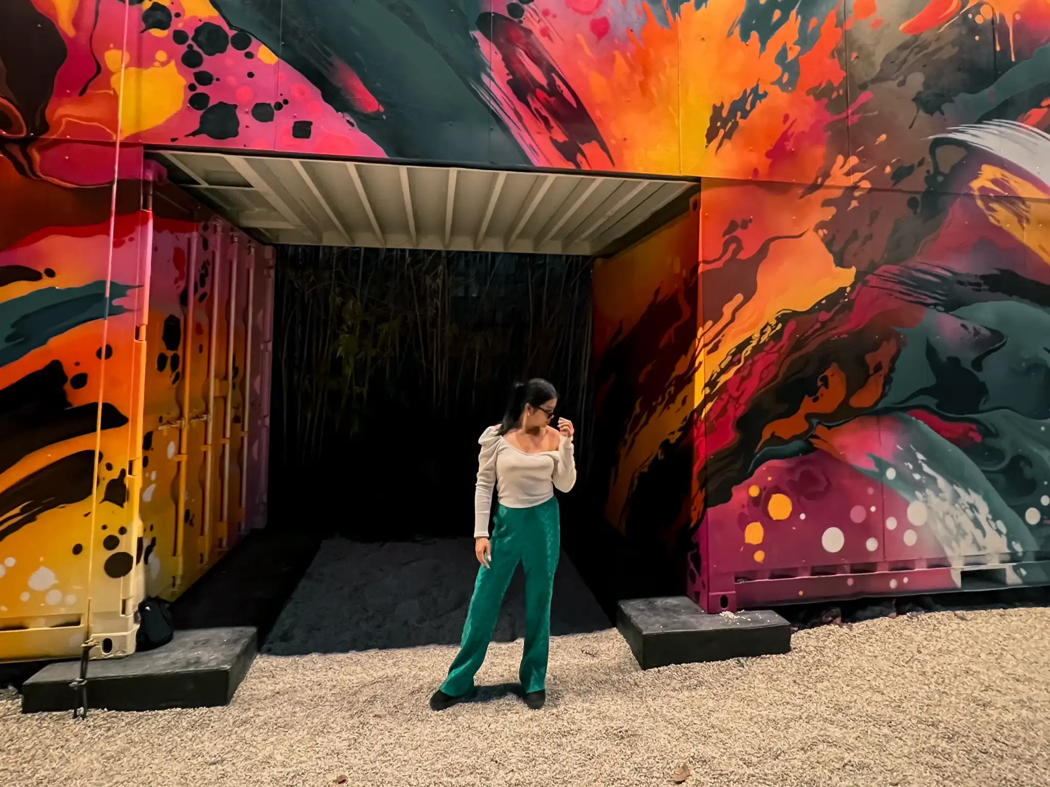 Linda standing in front of an abstract art tunnel