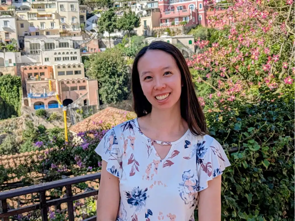 Provisional psychologist Karen Tang standing in front city landscape