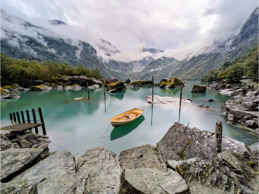 An empty row boat floating in a lake