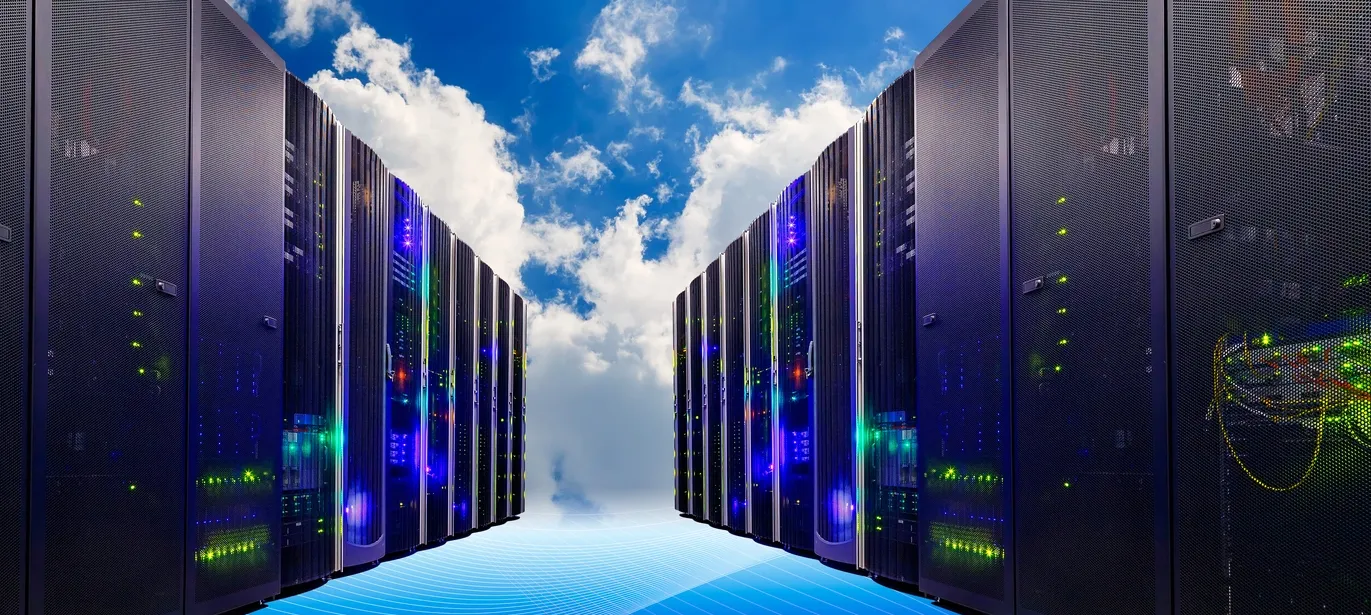 File server racks on both sides with blue sky and white clouds in the background.