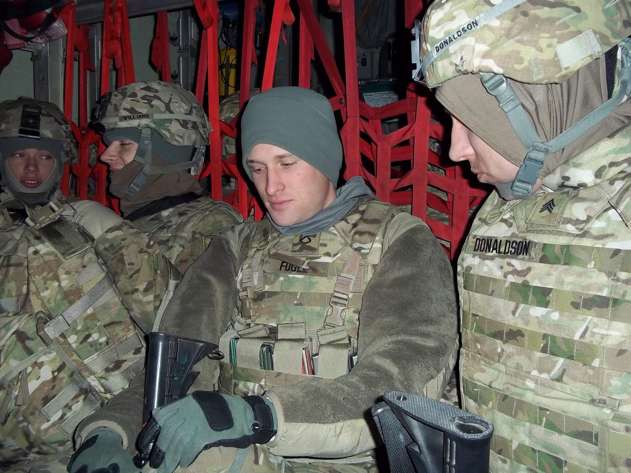 Lance Fogle with fellow soldiers inside a Chinook helicopter in Afghanistan