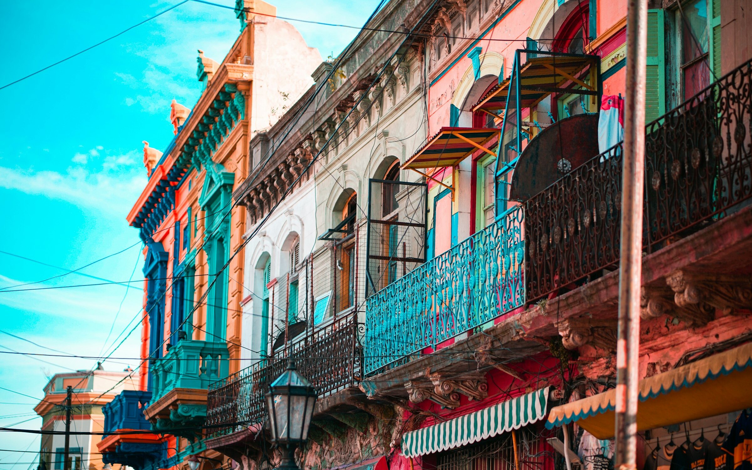 Brightly painted facades and wrought-iron balconies in La Boca, Buenos Aires