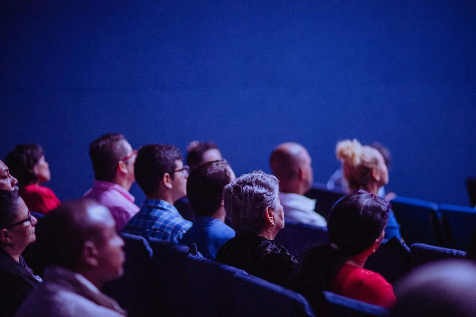 People sitting and listening to a speaker