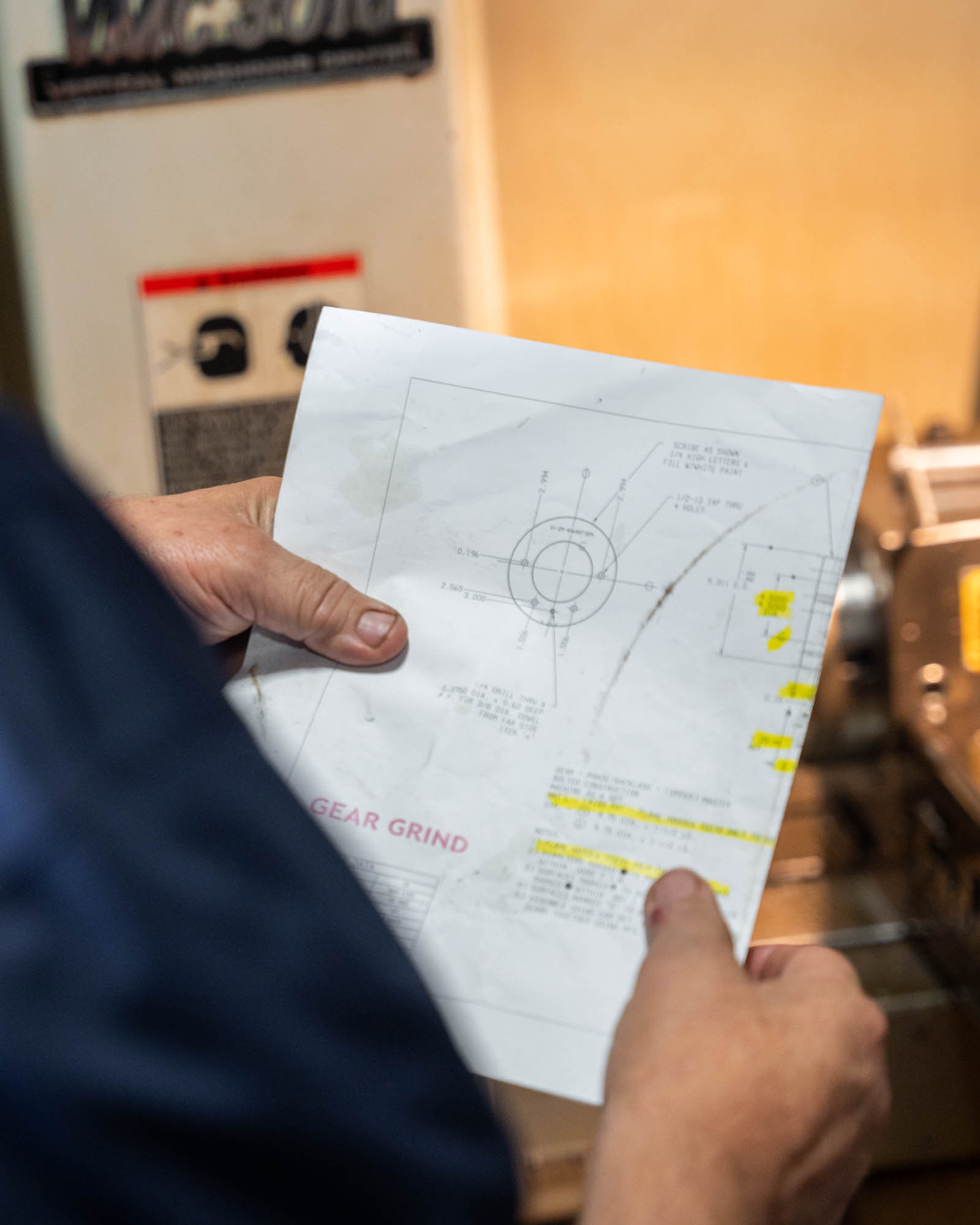 Machinist reading gear print.