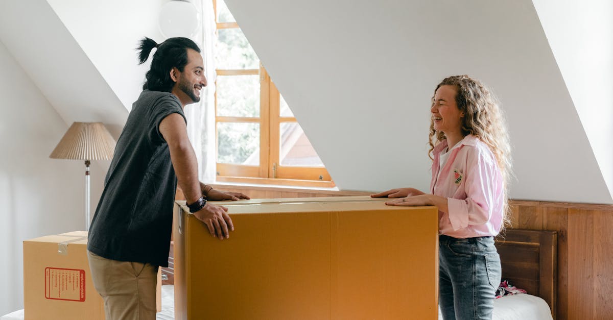 Smiling diverse couple moving in new house · Free Stock Photo