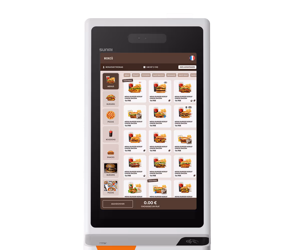 Borne de commande tactile Sunmi affichant un menu numérique avec différentes options de burgers, pizzas, boissons et snacks en français.