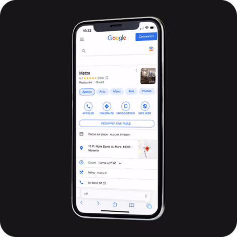 Capture d'écran d'un téléphone affichant la fiche Google d'un restaurant nommé Matza, avec options pour appeler, itinéraire, menu, avis, photos, et bouton pour réserver une table.