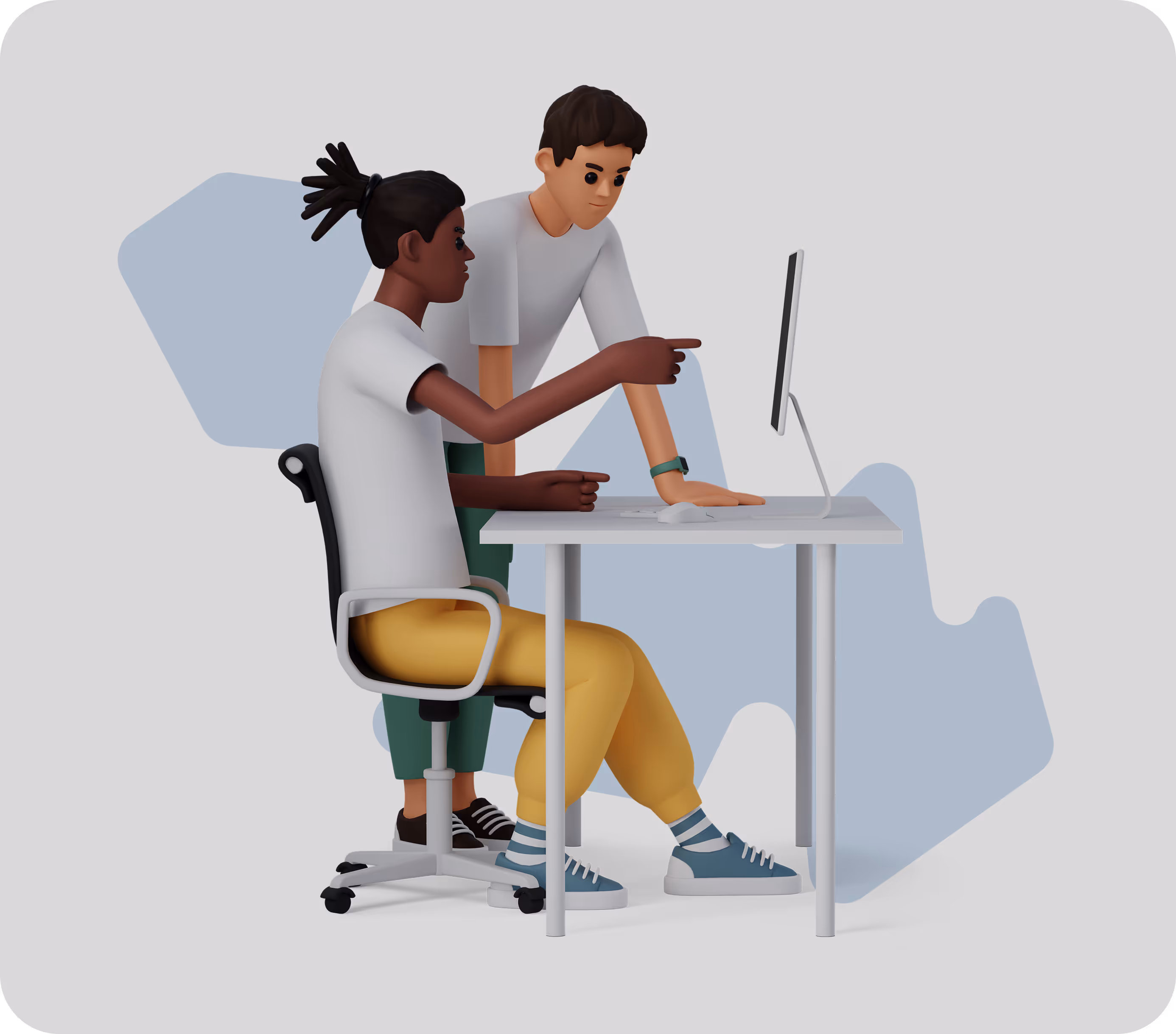 Two men collaborating at a desk with a computer, one seated and pointing at the screen, the other standing and observing.