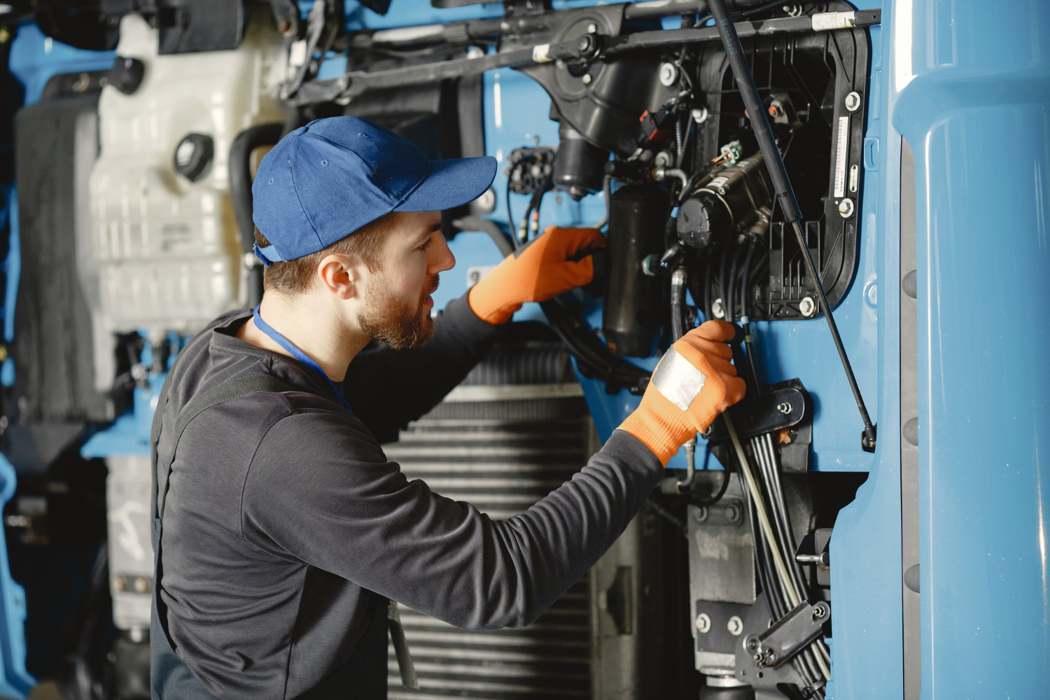 Technician using diagnostic equipment on machinery