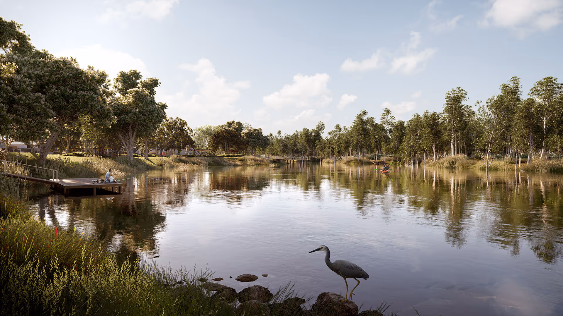 A calm lakeside scene with trees reflecting on the water, a person fishing from a small wooden jetty on the left, and a heron standing on rocks in the foreground.