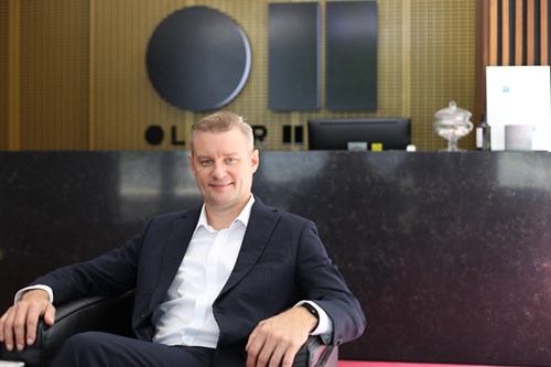 Image of Matt Bell sitting in the Oliver Hume office Lobby