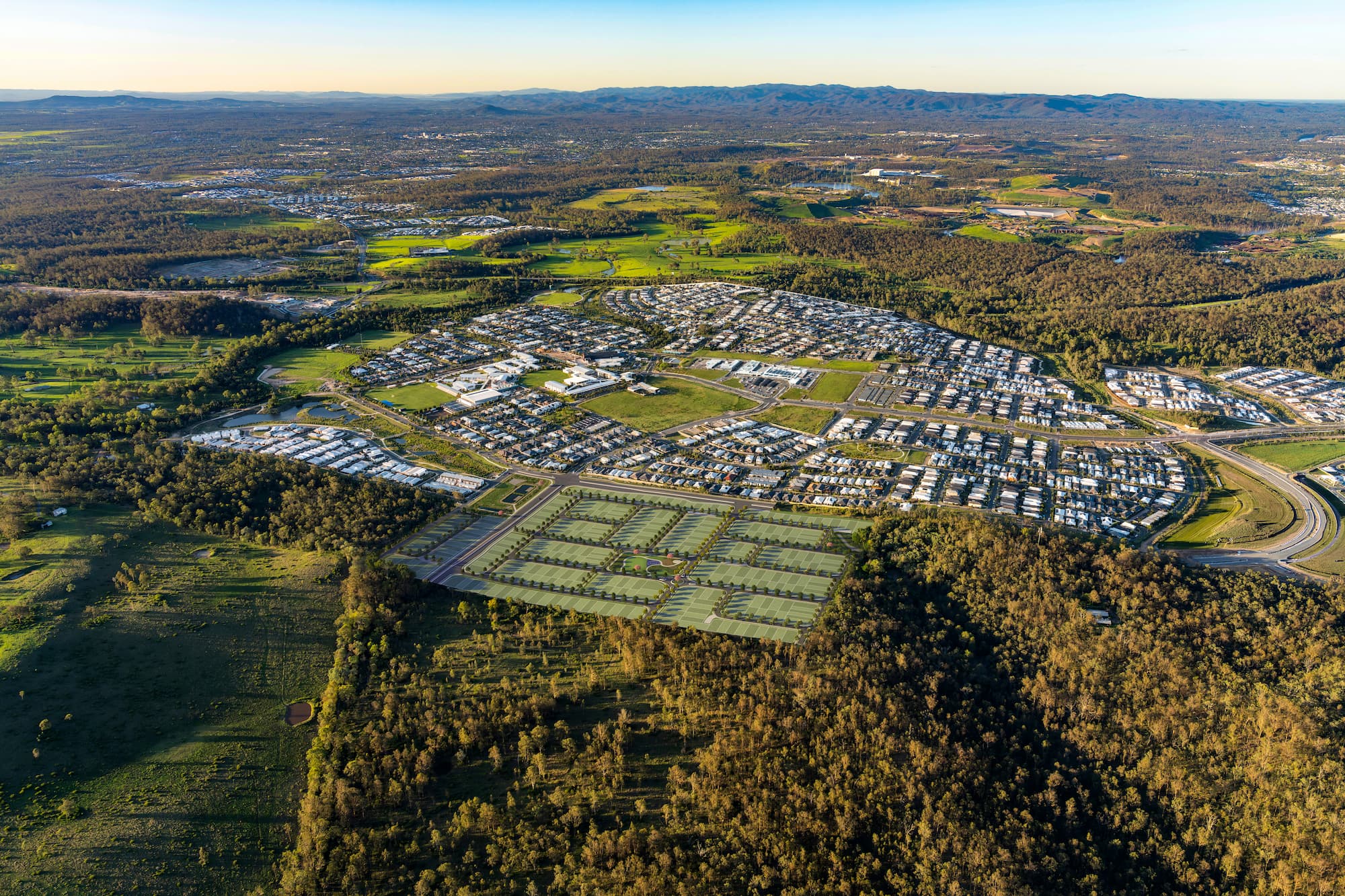Artist's aerial overview of the proposed Silva South Ripley community, showing planned residential lots surrounded by established neighbourhoods and natural bushland.