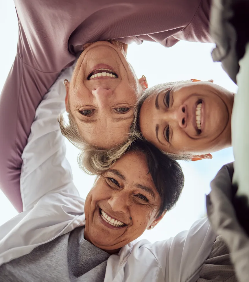 Three woman looking down at the camera