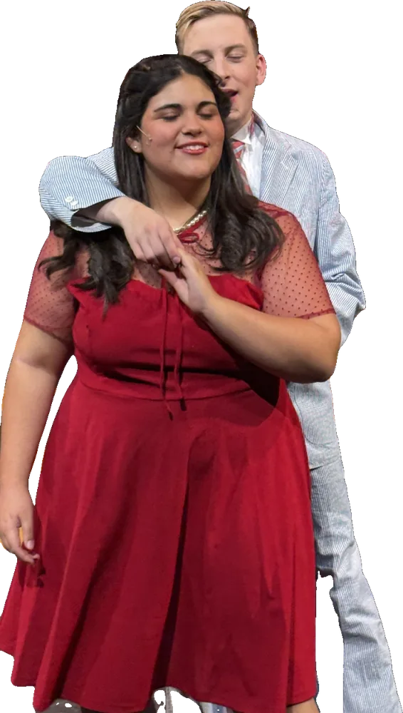 Two Tapestry actors embrace on stage in Bye Bye Birdie