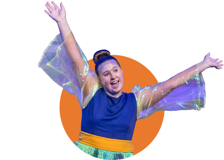 A Tapestry actor as Dory throws her arms wide on stage in Finding Nemo Jr.