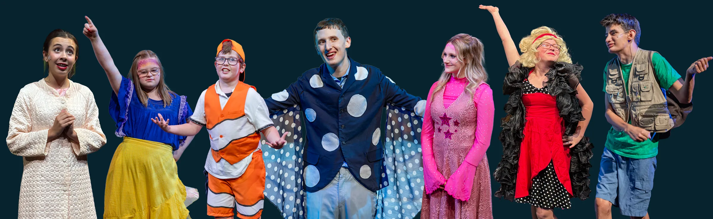 Seven Tapestry actors in costume from past shows smile and pose together on stage