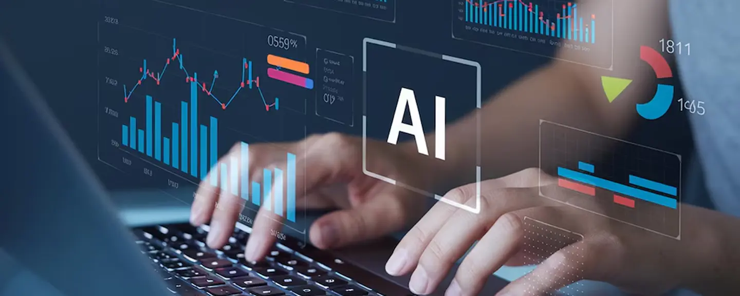 Hands typing on a laptop with digital charts and AI graphics, representing artificial intelligence, data and analytics solutions.