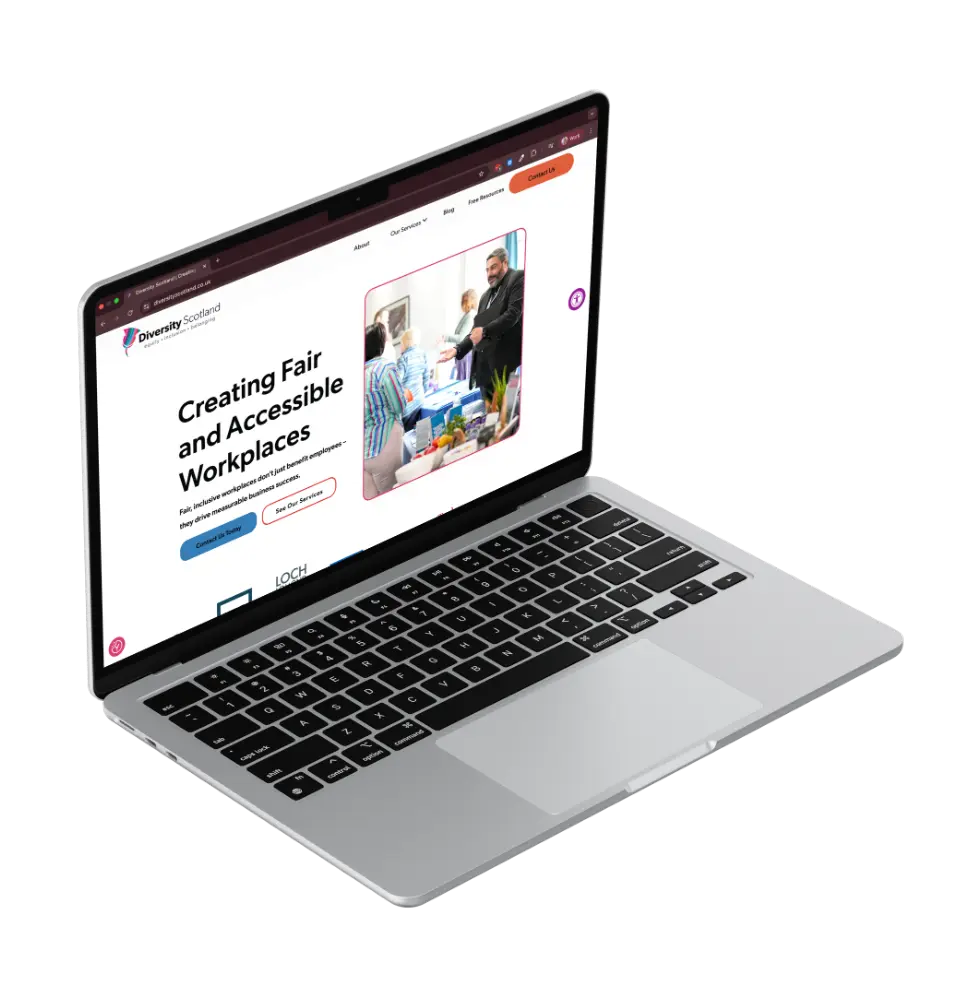 floating laptop screen showing the homepage for Diversity Scotland