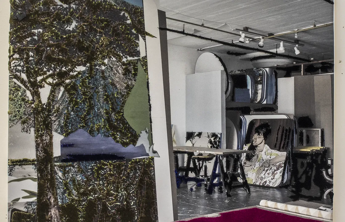 Art studio with large mirrors leaning against the walls and a table in the center, featuring an artwork of a woman on one mirror.