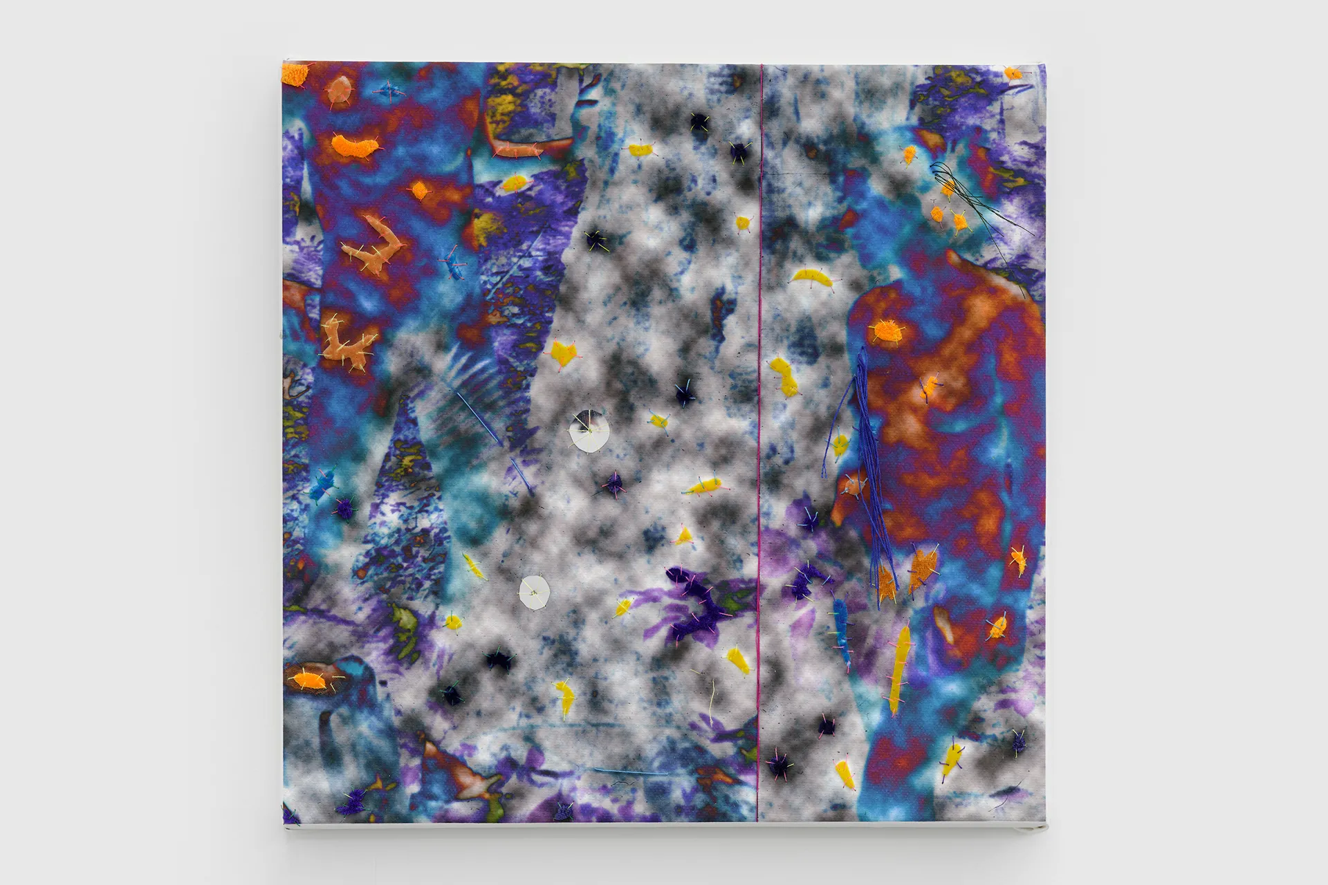 Abstract colorful artwork on a square canvas featuring blurry blue, purple, orange, and black patterns with various small embroidered stitches.
