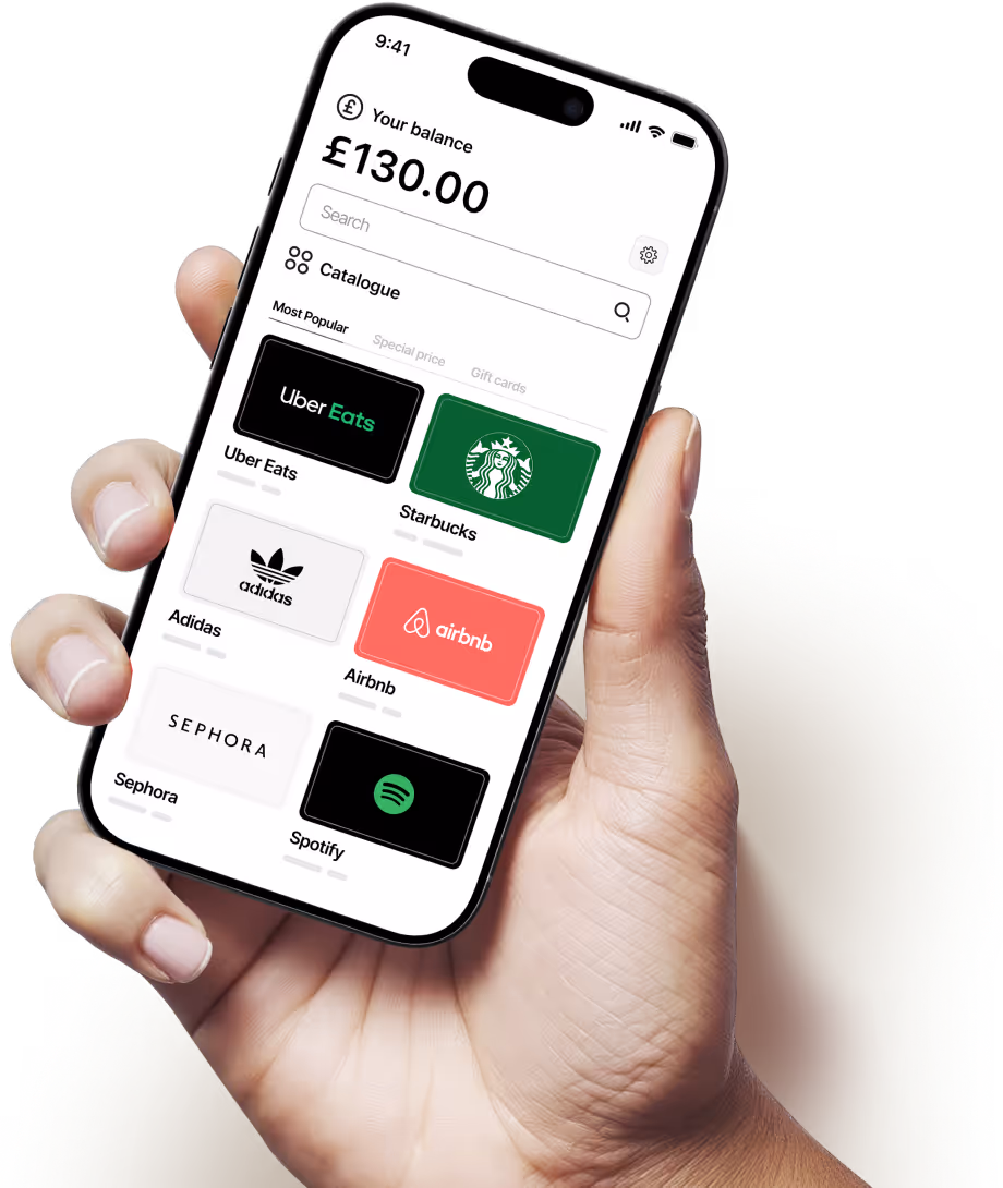 Hand holding smartphone displaying a digital wallet app