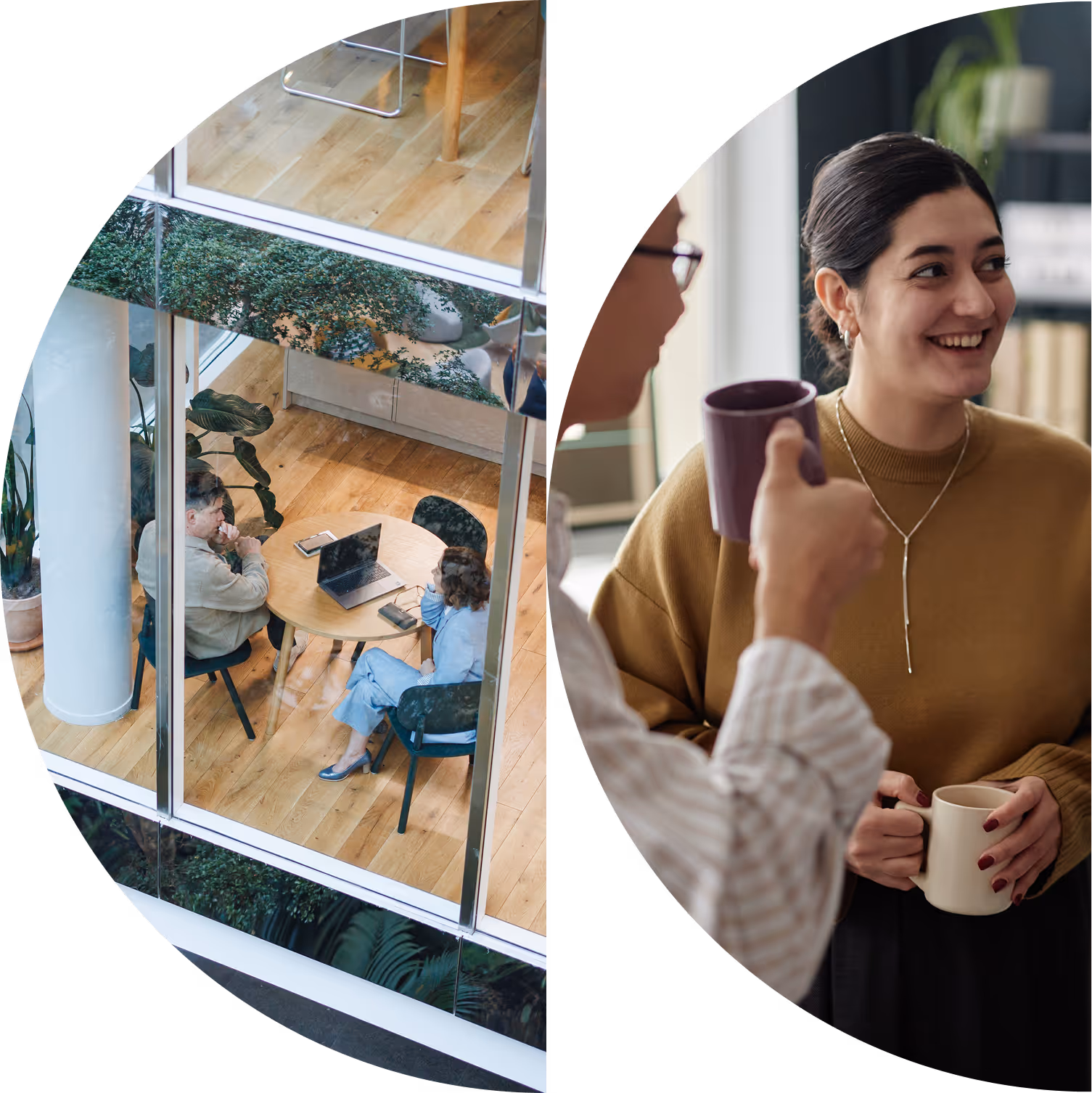 Two colleagues having a meeting at a round table seen through an office window, alongside a smiling woman chatting and holding a coffee mug with another person.