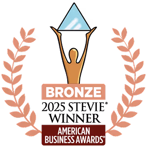 Bronze American Business Awards trophy with a figure holding a blue triangular prism and laurel branches on both sides.