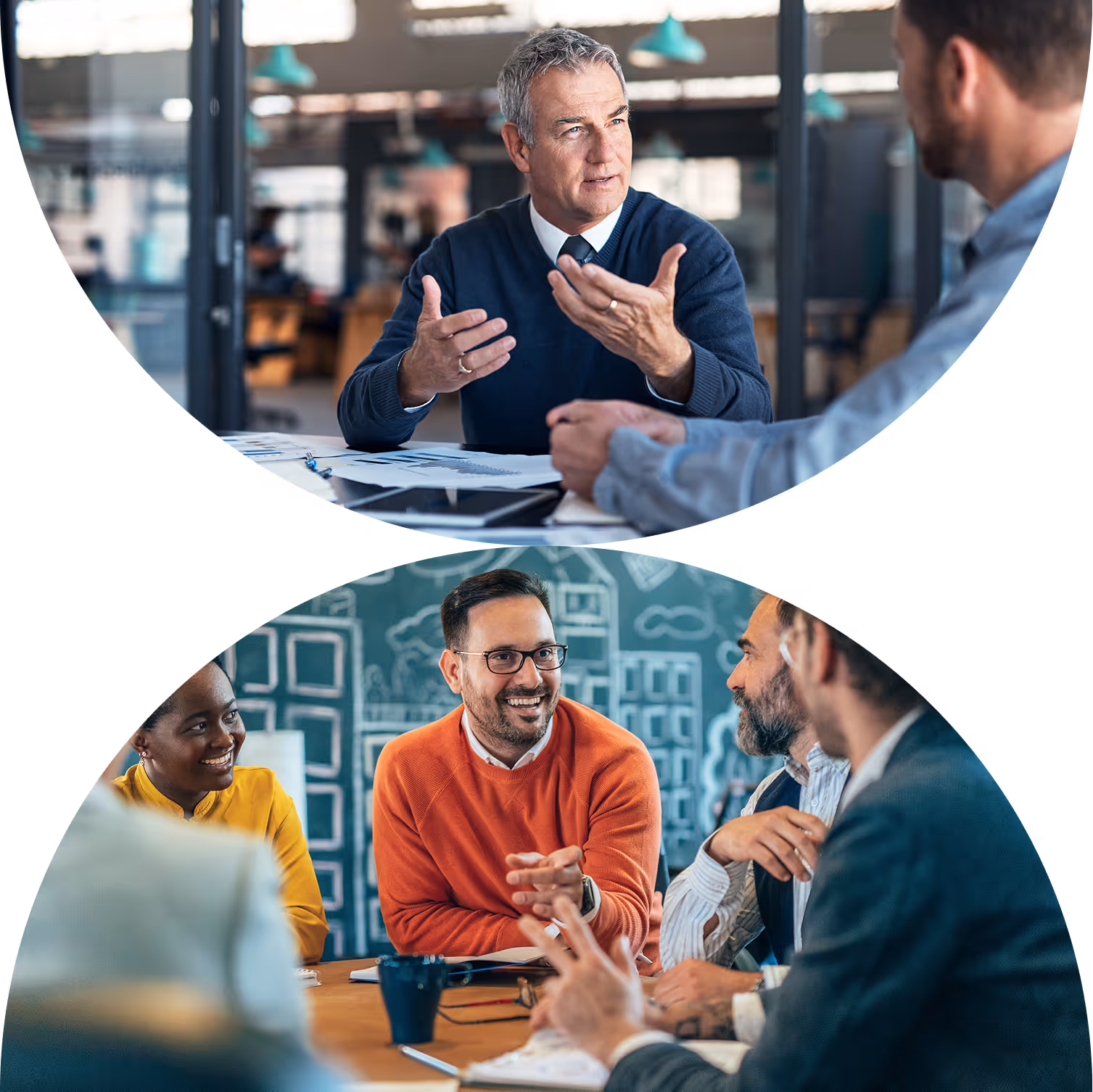 People sitting at a desk in an office smiling and talking to each other