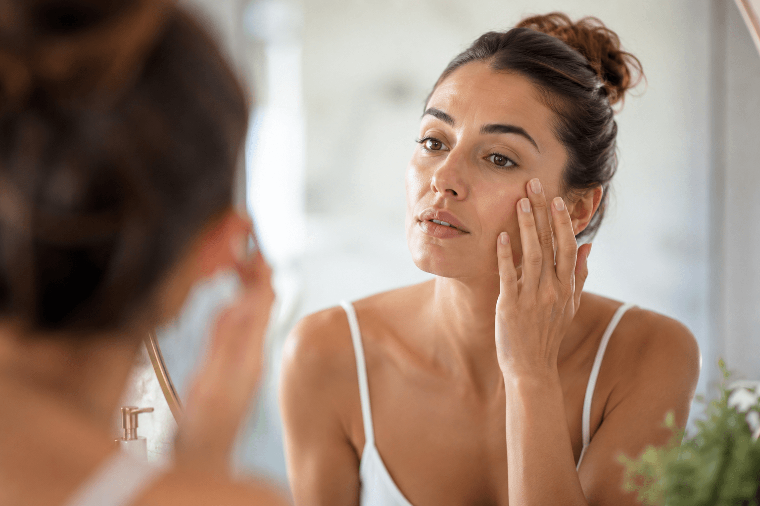 Licensed esthetician performing a Microneedling treatment to improve fine lines and stimulate collagen at a skincare studio in Winter Park, Florida.