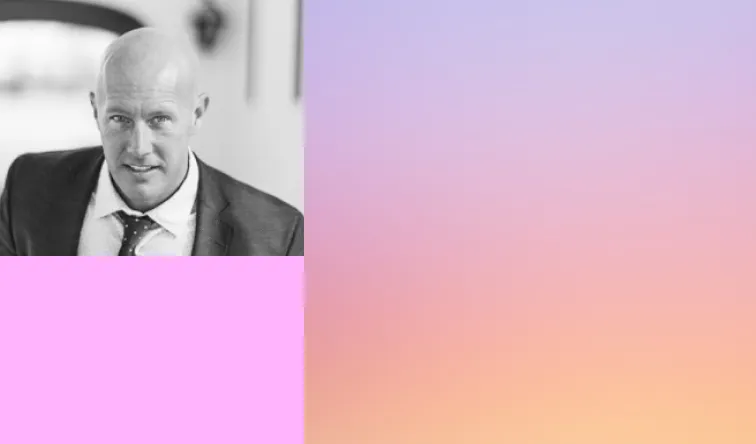 Black and white headshot of a bald man in a suit, next to a pink color block and a lavender to orange gradient background.