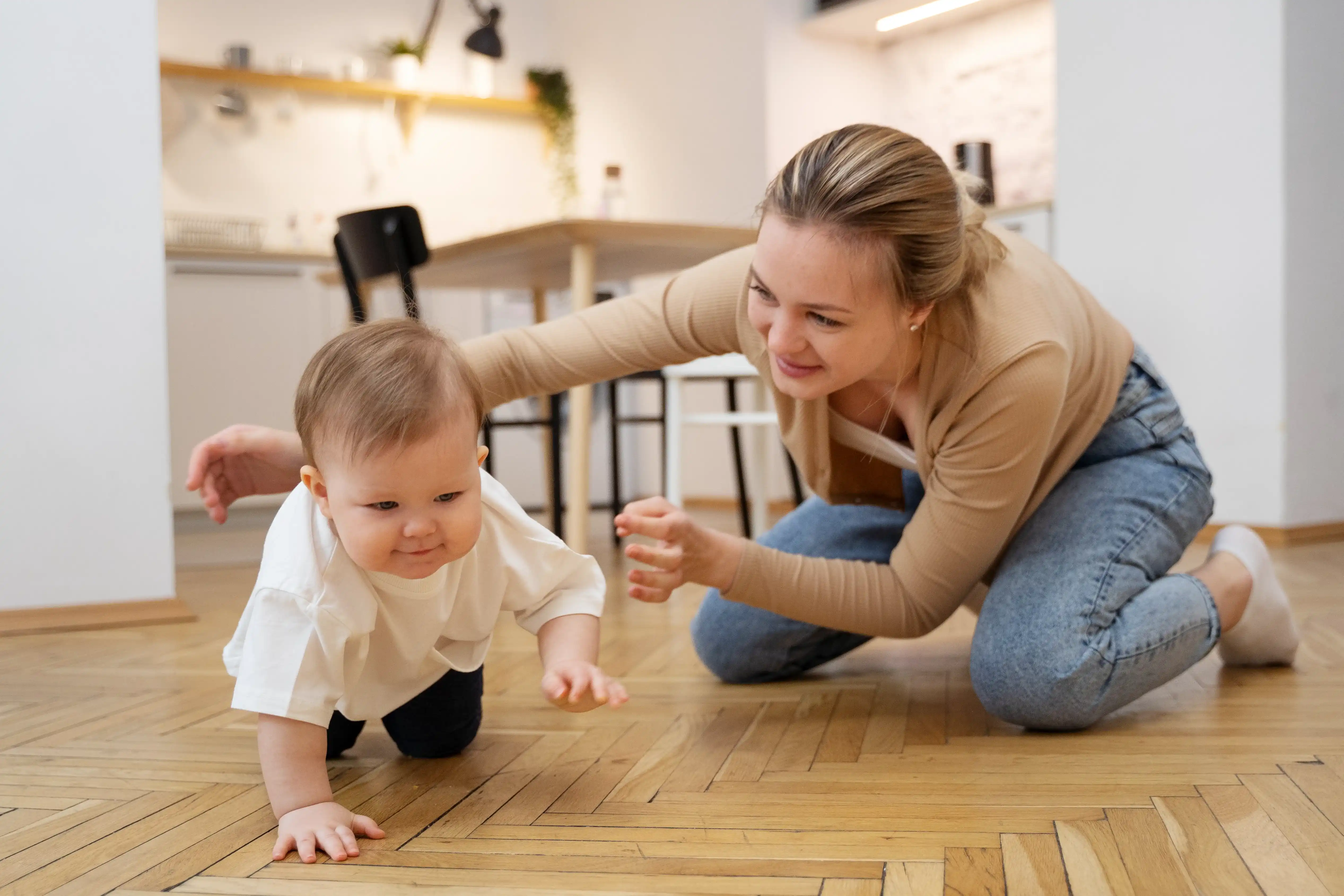 full-shot-Special Instructor-watching-baby-crawl