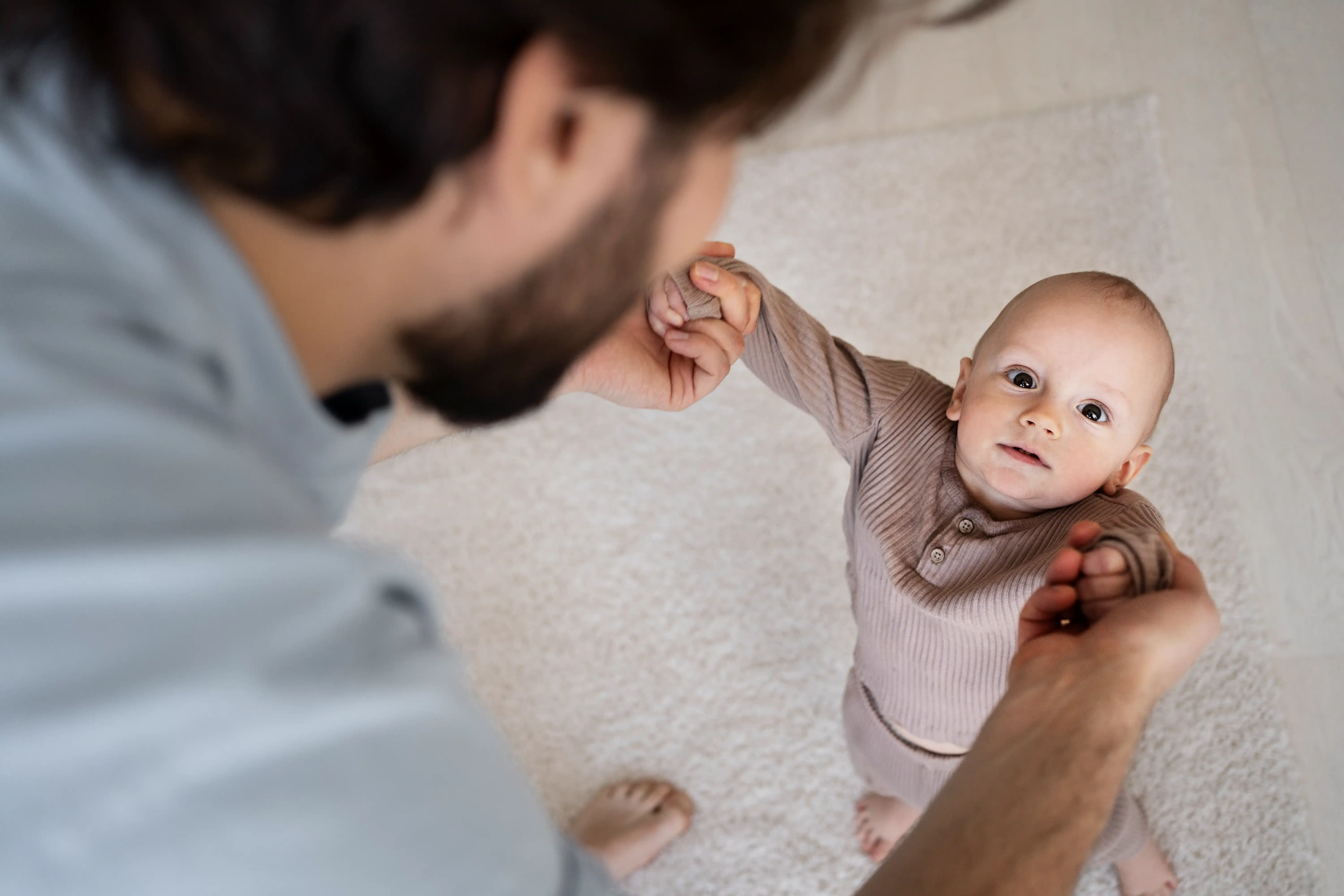 cute-baby-going-their-first-steps-with-physical-therapist